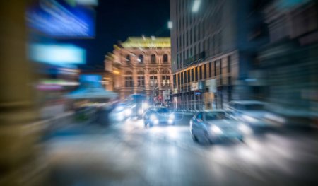 Photo for Wien, Austria - August 19, 2022: City traffic at night along a major city center road. - Royalty Free Image