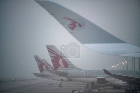 Photo for Doha, Qatar - September 17, 2018: Airplanes on the runway of Hamad International Airport. - Royalty Free Image