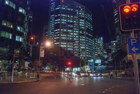 Photo for Brisbane, Australia - August 14, 2009: City street and modern buildings at night. - Royalty Free Image