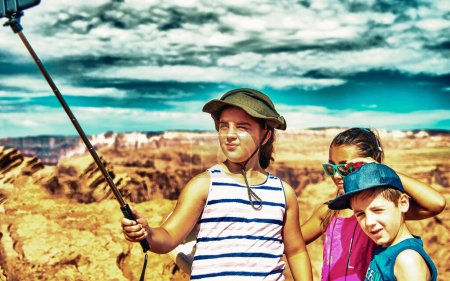 Photo for Group of three children exploring national park in summer season. - Royalty Free Image