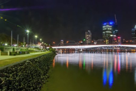 Photo for Brisbane, Australia - August 14, 2009: Night city view with skyscrapers reflections on city river. - Royalty Free Image