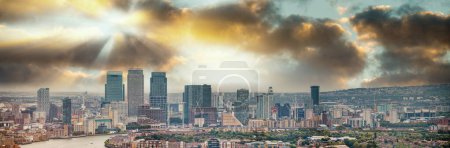 Photo for London - UK. Aerial panoramic view of Canary Wharf modern buildings at sunset. - Royalty Free Image