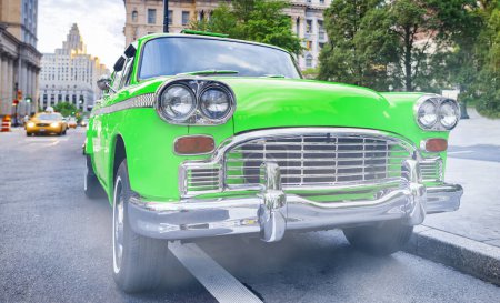 Photo for Vintage chequered green taxi cab in New York City. Manhattan street traffic. - Royalty Free Image