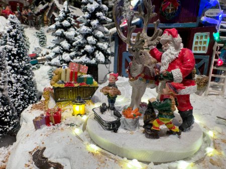 Foto de Santa toy in Christmas decorations. - Imagen libre de derechos
