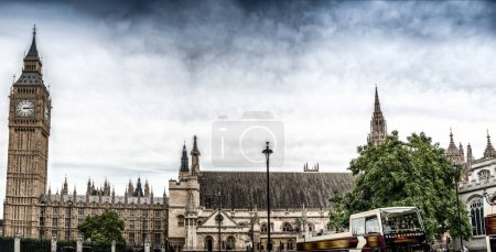 Photo for Sunset view of Big Ben and Westminster Palace with city traffic, London - UK. - Royalty Free Image
