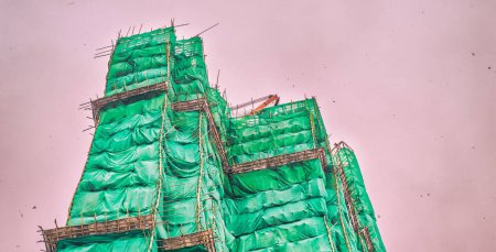 Photo for Palace under contruction wrapped by scaffolding and sheets - Royalty Free Image