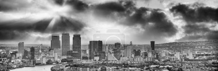 Photo for London - UK. Aerial panoramic view of Canary Wharf modern buildings at sunset. - Royalty Free Image