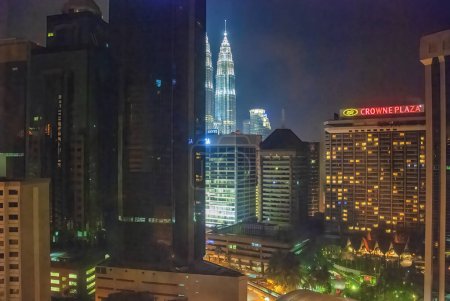 Photo for Kuala Lumpur, Malaysia - August 9, 2009: Petronas Twin Towers, aerial view at night. - Royalty Free Image