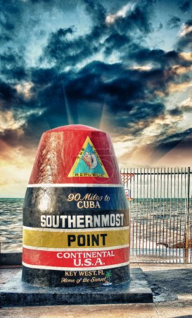 Photo for Southernmost Point sign in Key West, Florida. Beautiful seascape with sunset sky. - Royalty Free Image