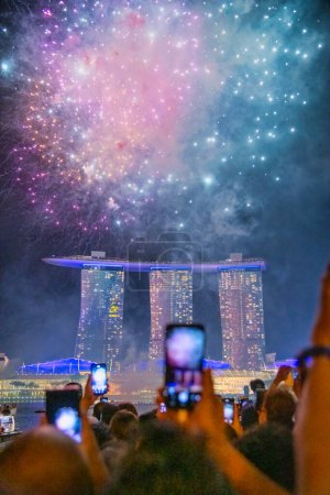 Photo for Singapore - December 31, 2019: Fireworks in the sky for New Year's Eve. - Royalty Free Image