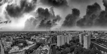 Photo for Panoramic aerial view of Berlin skyline at sunset with major city landmarks along Spree river, Germany from drone in summer season - Royalty Free Image