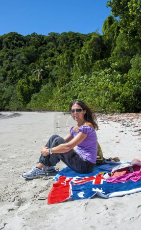 Foto de Portrait of a happy caucasian woman relaxing on a beautiful tropical beach. - Imagen libre de derechos