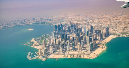 Photo for DOHA, QATAR - SEPTEMBER 17, 2018: Aerial view of West Bay and Corniche from the airplane - Royalty Free Image