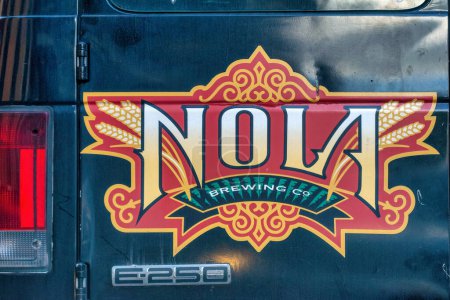 Photo for New Orleans, LA - February 11, 2016: NOLA Brewing Co. advertisement on a car exterior. - Royalty Free Image