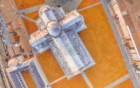 Foto de Downward aerial view of Pisa Cathedral in Square of Miracles. Piazza del Duomo from drone, Italy. - Imagen libre de derechos