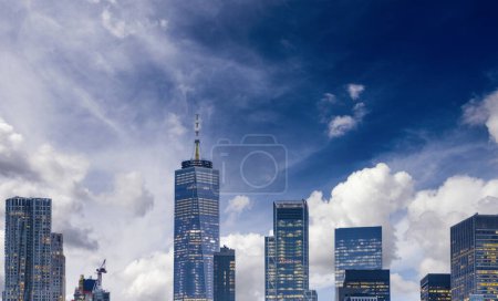Photo for New York City at sunset. Panoramic view of Downtown Manhattan buildings from the water. - Royalty Free Image