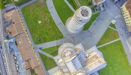 Foto de Downward aerial view of Pisa Cathedral and Tower in Square of Miracles. Piazza del Duomo from drone, Italy. - Imagen libre de derechos