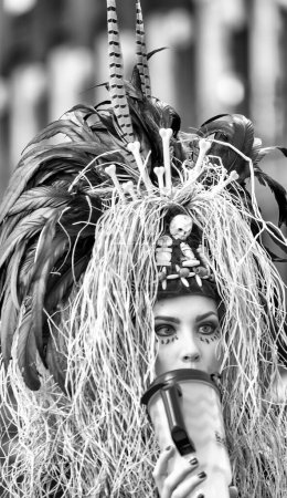 Téléchargez les photos : New Orleans, LA - February 9, 2016: Woman masked for Mardis Gras carnival parade. - en image libre de droit