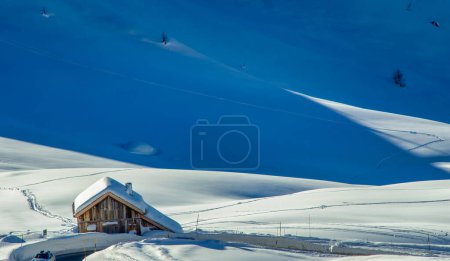 Photo for Wooden Hut in the middle of a valley covered by snow in winter season. - Royalty Free Image