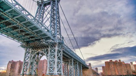 Photo for The Manhattan Bridge in New York City as seen from a ferry boat navigating East River - Royalty Free Image