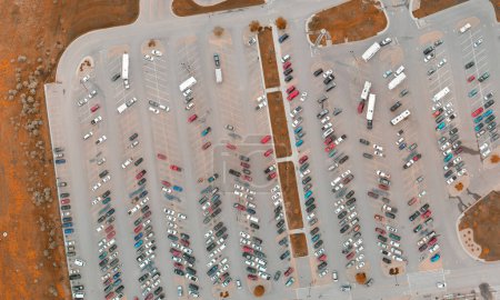 Photo for Overhead downward aerial view of city parking with many cars of different colors. - Royalty Free Image