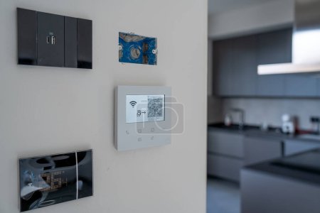 Photo for Moving to a new house. Control center with Usb port, Thermostat and video intercom. - Royalty Free Image