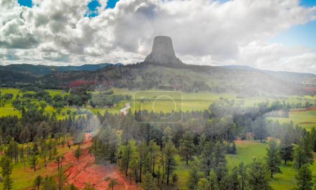 Photo for Devil's Tower National Monument and surrounding landscape in summer season. Beautiful aerial view on a sunny afternoon. - Royalty Free Image