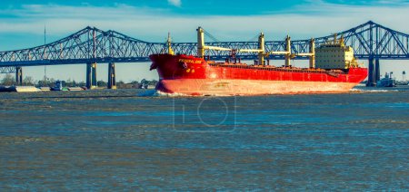 Téléchargez les photos : New Orleans, LA - February 8, 2016: Oil tanker passes under a bridge. - en image libre de droit