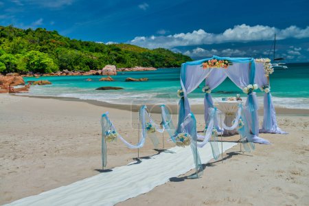 Wedding gazebo setup. Destination wedding on a white sand beach during summer. Exotic wedding on an isolated island.