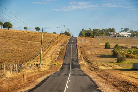 Photo for Across the Queensland countryside, straight road up to the hill - Australia. - Royalty Free Image