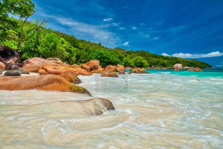 Amazing picturesque paradise beach with granite rocks and white sand, turquoise water on a tropical landscape, Seychelles.