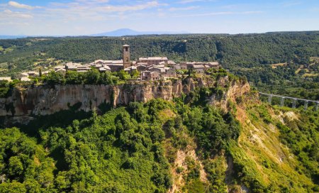 Photo for Panoramic aerial view of Civita di Bagnoregio from a flying drone around the medieval city, Italy - Royalty Free Image