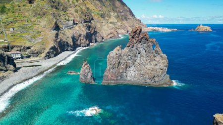 Téléchargez les photos : Aerial view of tall lava rocks in ocean, islet towers in Ribeira da Janela, Madeira, Portugal. - en image libre de droit