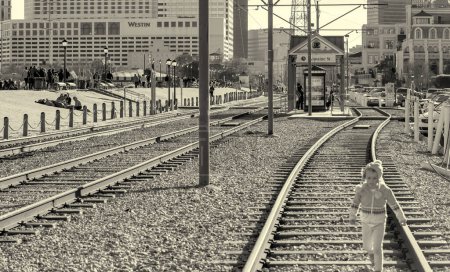 Photo for New Orleans, LA - February 8, 2016: City railway and buildings at sunset. - Royalty Free Image