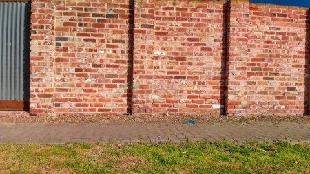 Photo for Red brick walls against a beautiful blue sky. - Royalty Free Image