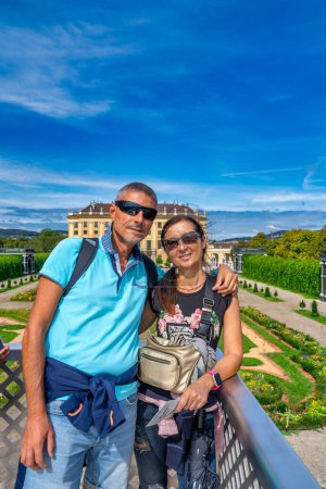 Photo for Vienna family tourism. A happy couple visiting Schonbrunn Park. - Royalty Free Image