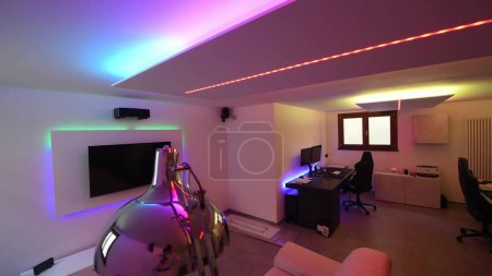 Photo for Modern room with bight led strips light. Tv, monitor and sofa. - Royalty Free Image