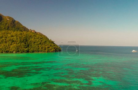 Photo for Phi Phi Don, Thailand. Aerial view of Phi Phi Island coastline from drone on a hot sunny day - Royalty Free Image