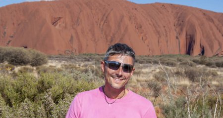 Photo for Portrait of a happy caucasian man hiking along the australian outback on a beautiful sunny day. - Royalty Free Image