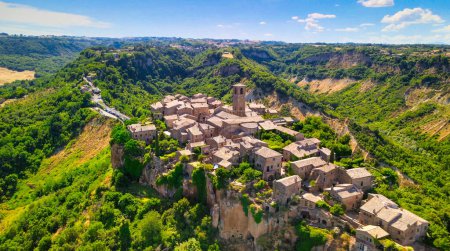 Photo for Panoramic aerial view of Civita di Bagnoregio from a flying drone around the medieval city, Italy - Royalty Free Image