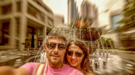Photo for Selfie of a happy caucasian couple on vacation visiting Kuala Lumpur, Malaysia. - Royalty Free Image