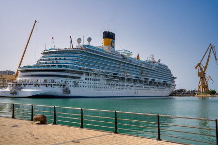 Photo for Cadiz, Spain - April 8, 2023: A cruise ship in the city port on a sunny day. - Royalty Free Image