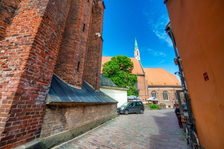 Photo for Riga, Latvia - July 7, 2017: Riga streets and ancient buildings on a sunny day. - Royalty Free Image