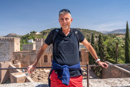 Photo for A happy male caucasian tourist visiting Alcazaba in Granada - Spain - Royalty Free Image