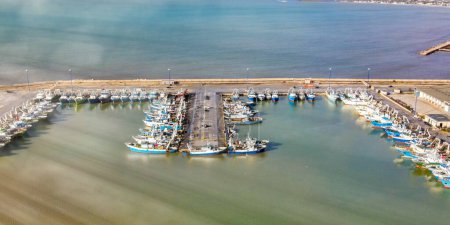 Photo for Fishing boats in the port of Mazara del Vallo in Sicily, aerial overhead view from drone - Royalty Free Image
