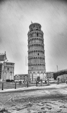 Photo for Pisa under the snow. Famous landmarks and monuments of Field of Miracles after a snowstorm. - Royalty Free Image