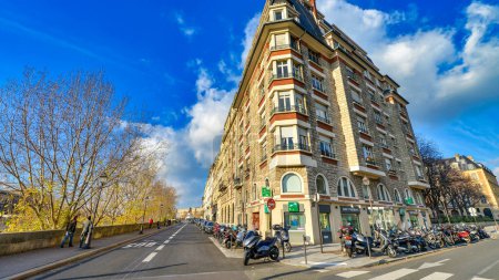 Photo for Paris - December 2012: Streets and buildings of Paris on a sunny day. - Royalty Free Image