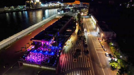 Photo for Madeira, Portugal - September 2, 2022: Aerial view of CR7 Disco with people dancing at night. - Royalty Free Image