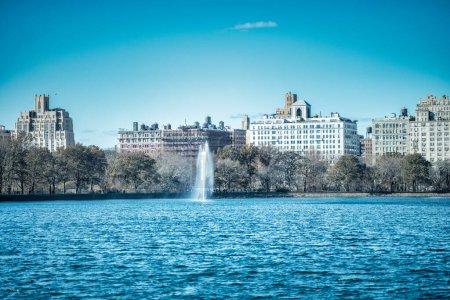 Photo for Buildings of Manhattan along Central Park lake, New York City in a beautiful winter morning. - Royalty Free Image