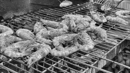 Photo for Cooking prawns on the grill at home. - Royalty Free Image
